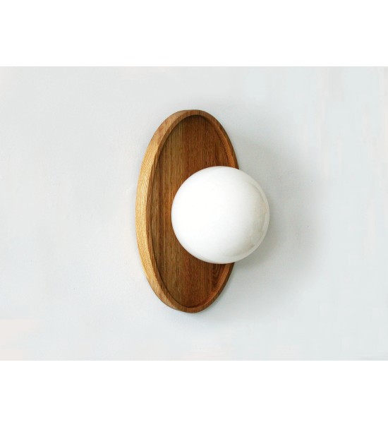 Oval wooden panel and opaline glass globe wall lamp