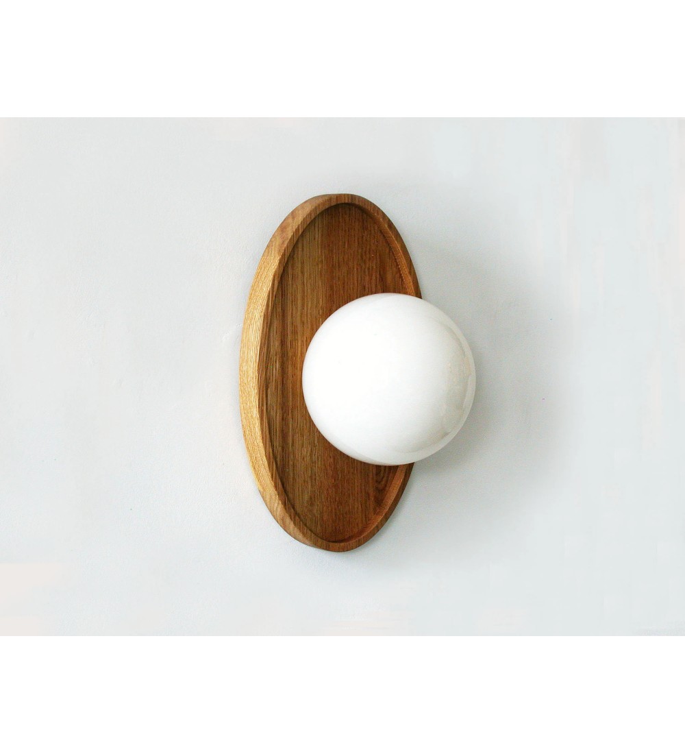 Oval wooden panel and opaline glass globe wall lamp