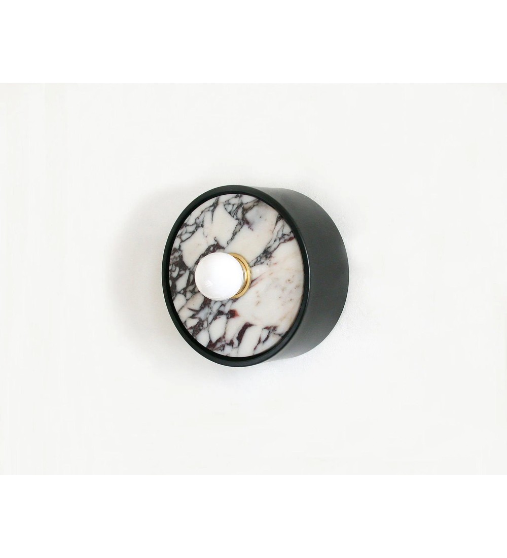 Wall sconce with black marble insert and opalescent bulb