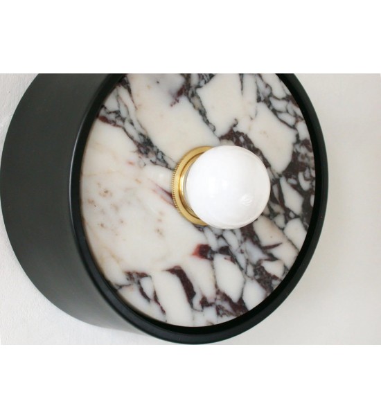 Wall sconce with black marble insert and opalescent bulb