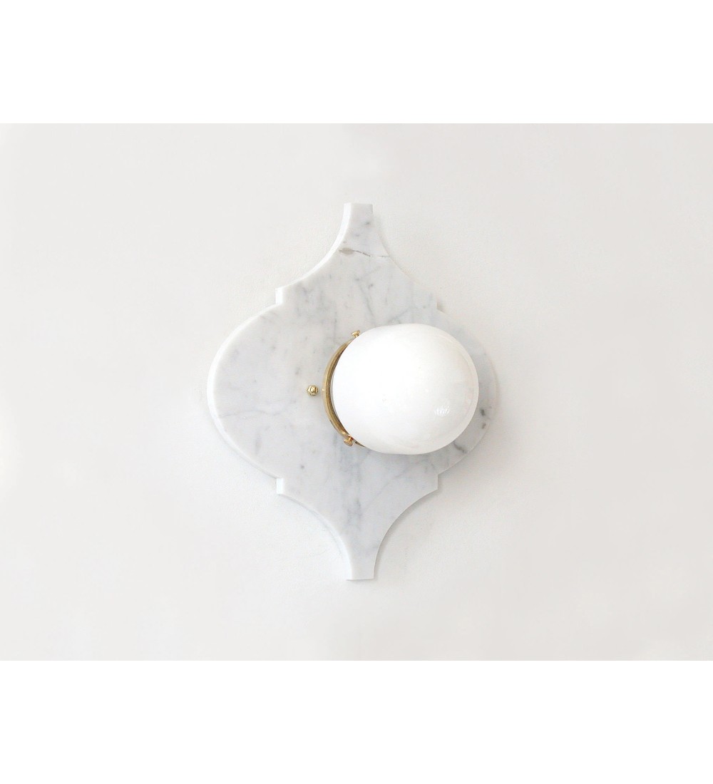 Quatrefoil marble panel and opal sphere wall light