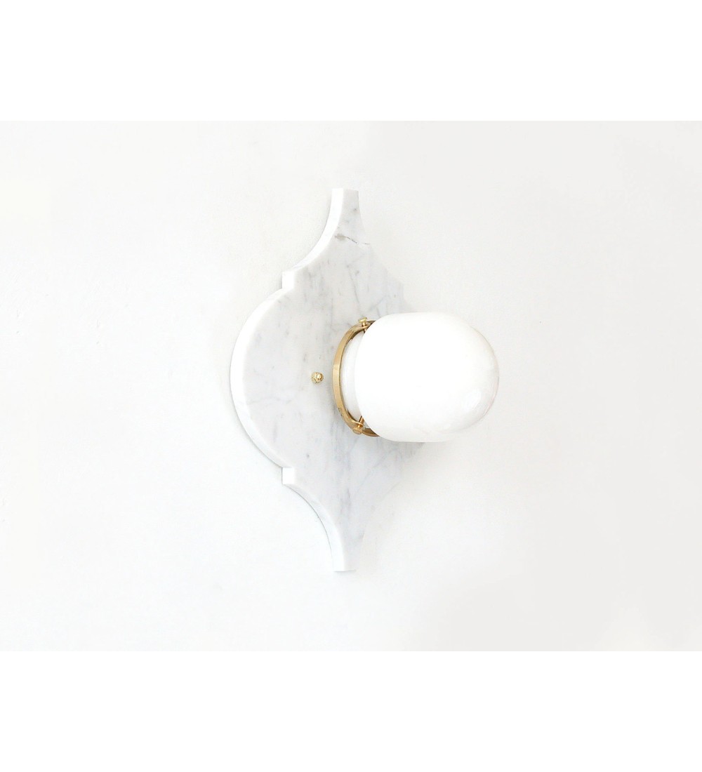 Quatrefoil marble panel and opal sphere wall light