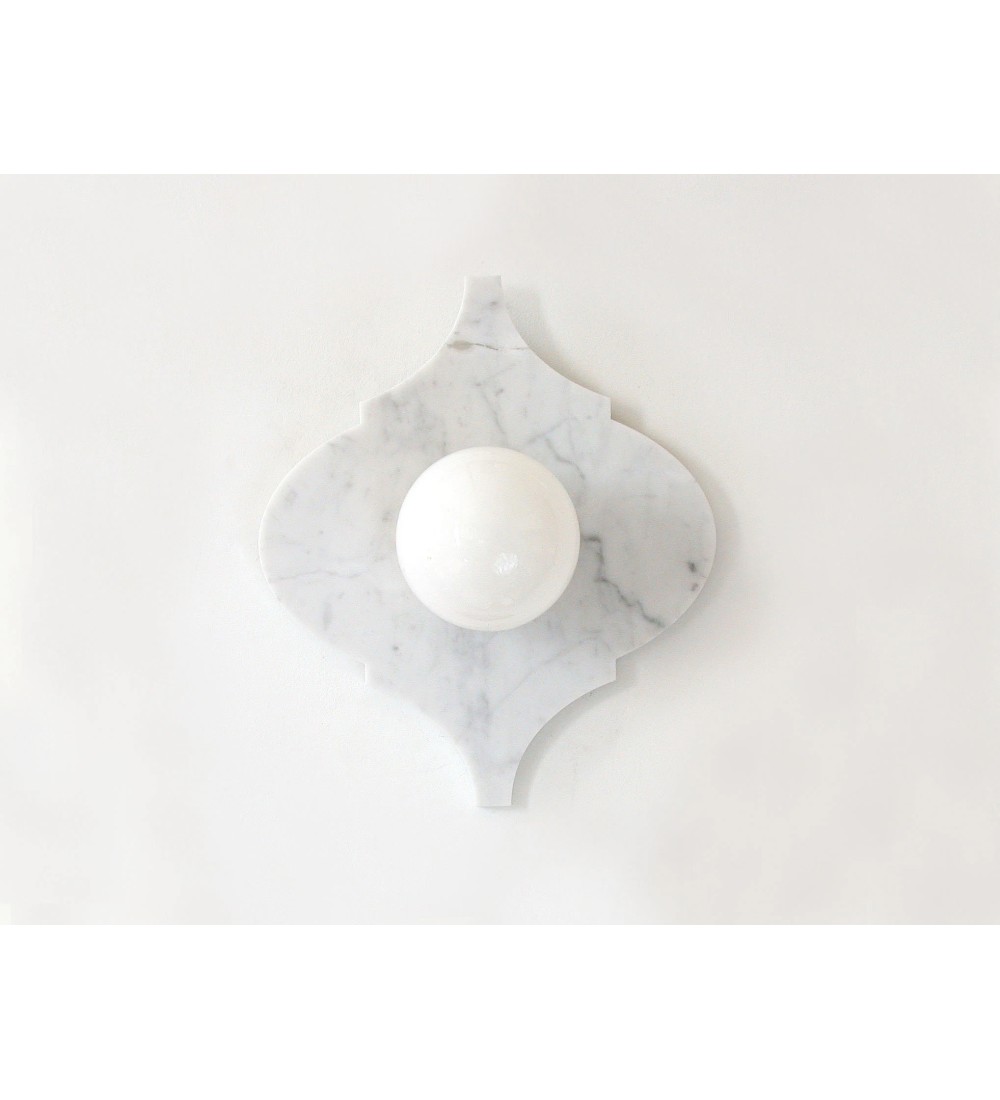 Quatrefoil marble panel and opal sphere wall light