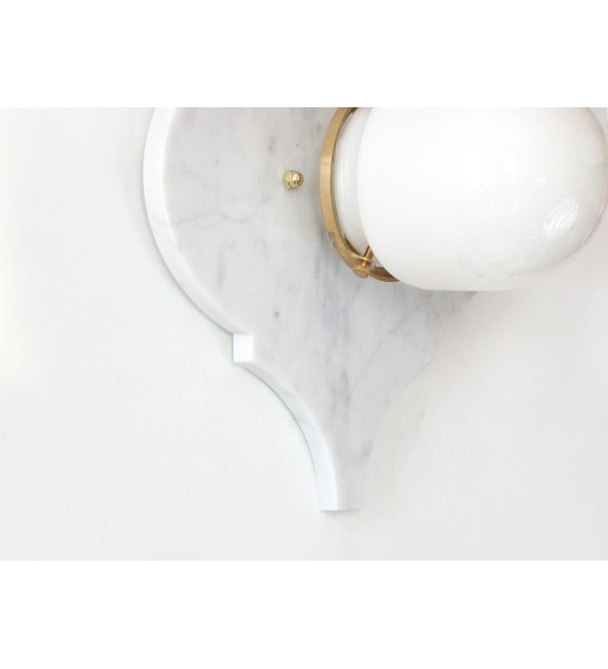 Quatrefoil marble panel and opal sphere wall light