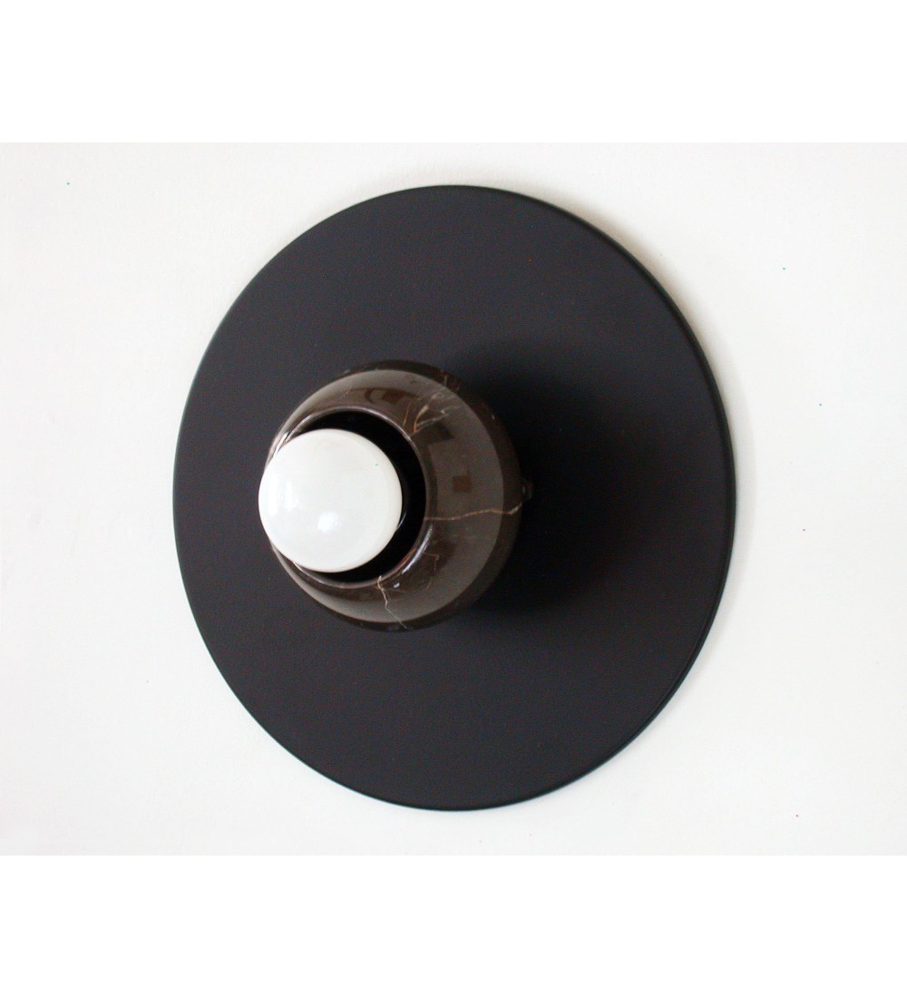 Black round marble cup and white bulb wall lamp