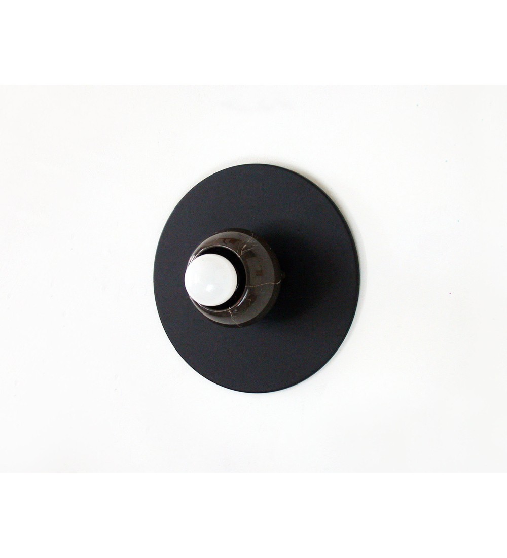 Black round marble cup and white bulb wall lamp