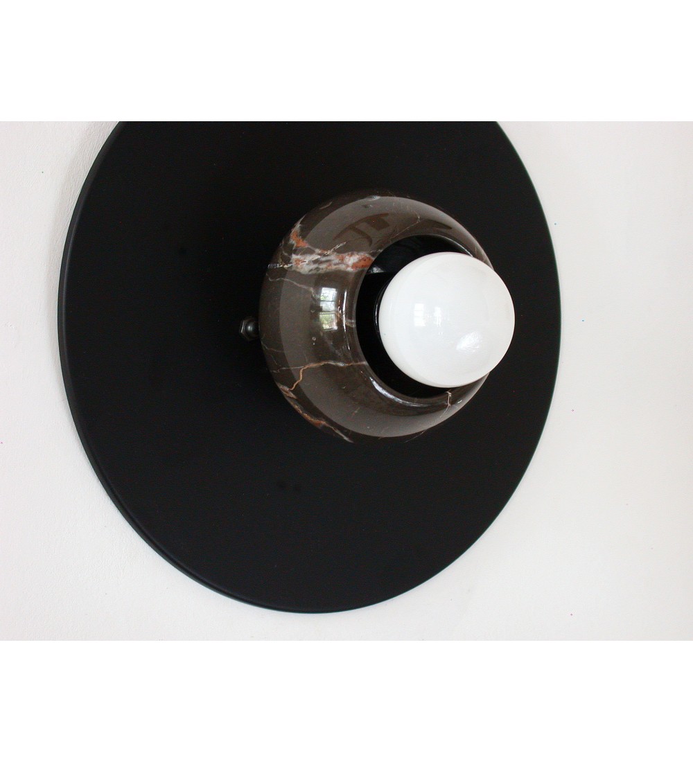 Black round marble cup and white bulb wall lamp